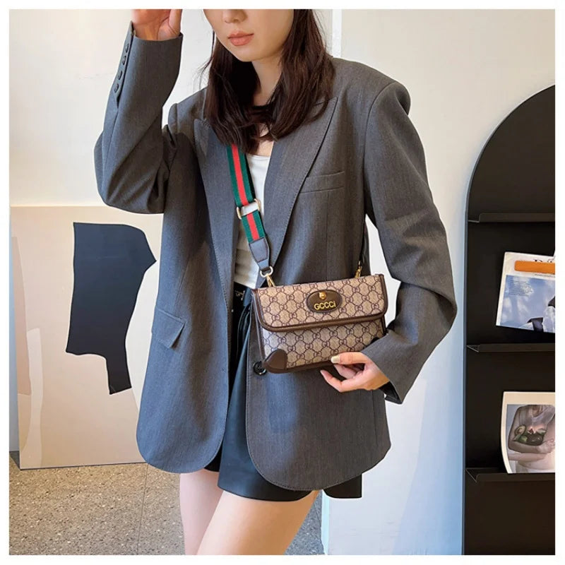 Lamp Post brown geometric print quilted shoulder bag with metal logo, lightweight PU, flap closure, magnetic snap, adjustable crossbody strap.