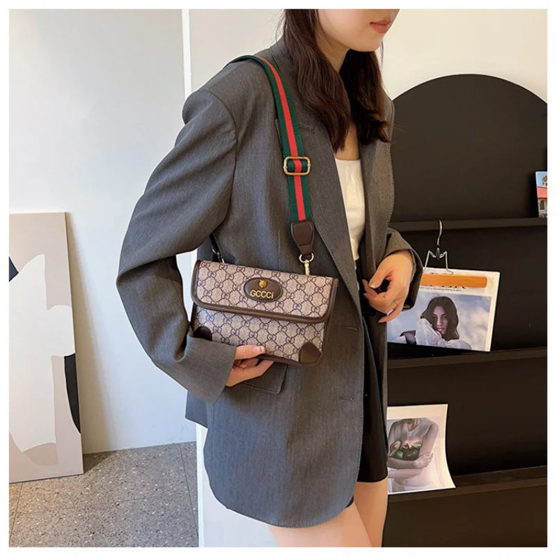 Lamp Post brown geometric print quilted shoulder bag with metal logo, lightweight PU material, flap closure, and adjustable crossbody strap.