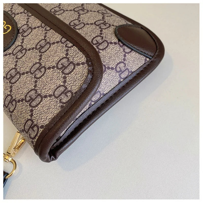 Lamp Post brown geometric print quilted shoulder bag with metal logo, lightweight PU material, flap closure, and adjustable crossbody strap.