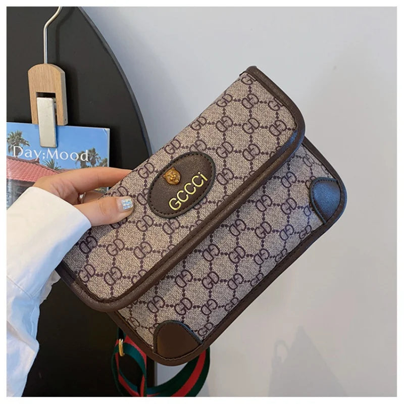 Lamp Post geometric print quilted leather shoulder bag with metal logo, adjustable strap, flap closure, and magnetic snap.