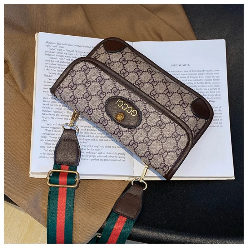 Lamp Post brown geometric print quilted fashion shoulder bag with metal logo, flap closure, magnetic snap, and adjustable crossbody strap.