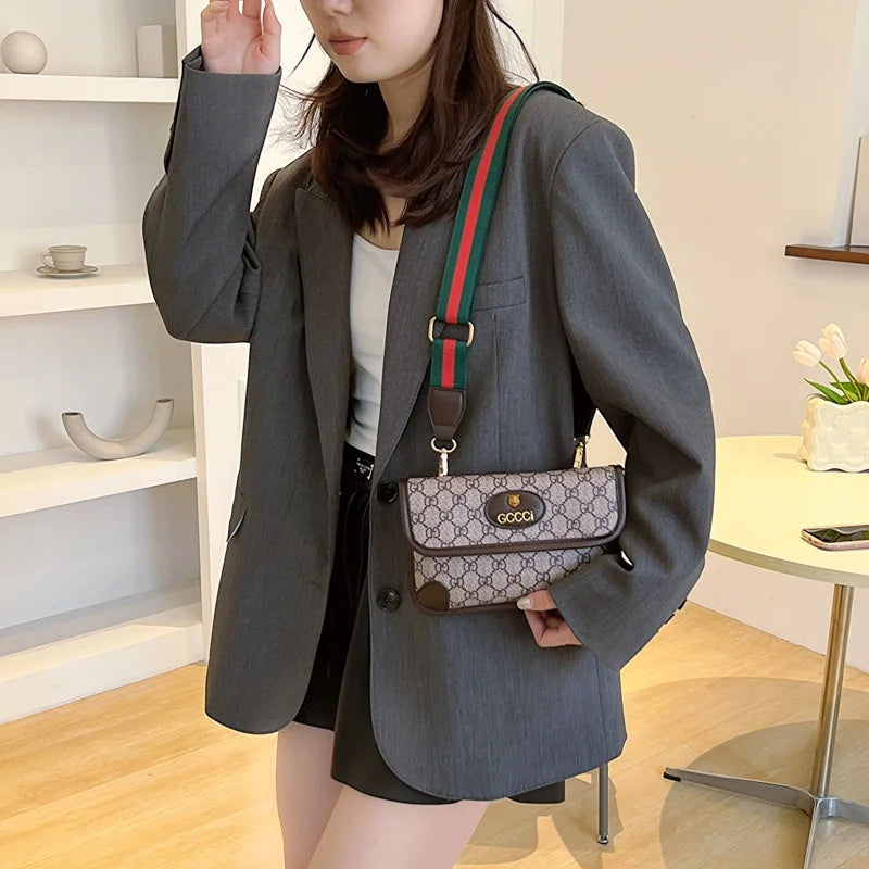 Lamp Post brown geometric print quilted shoulder bag with metal logo, adjustable strap, flap closure, and magnetic snap.