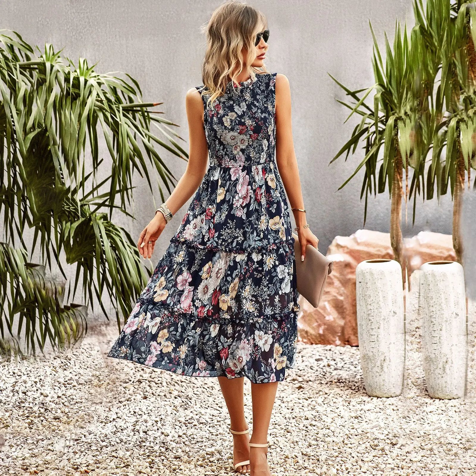 Blue summer women's sleeveless dress by Lamp Post, lightweight and stylish for warm weather, shown on a model.