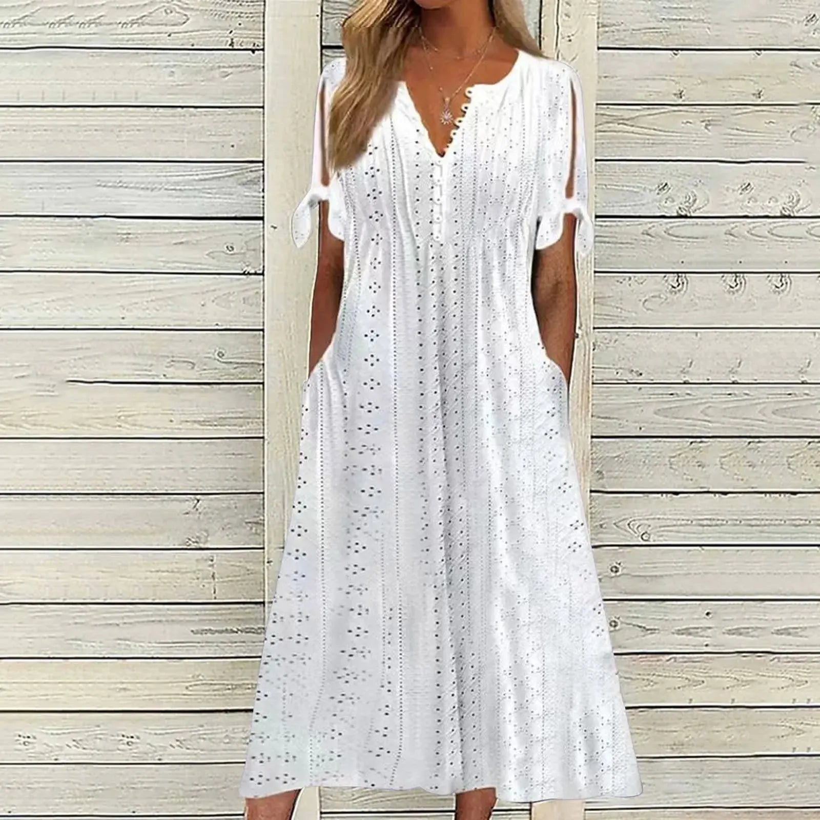 Elegant white party dress for ladies with hollow-out design, bow details, short sleeves, lace waist, and pockets, by Lamp Post.
