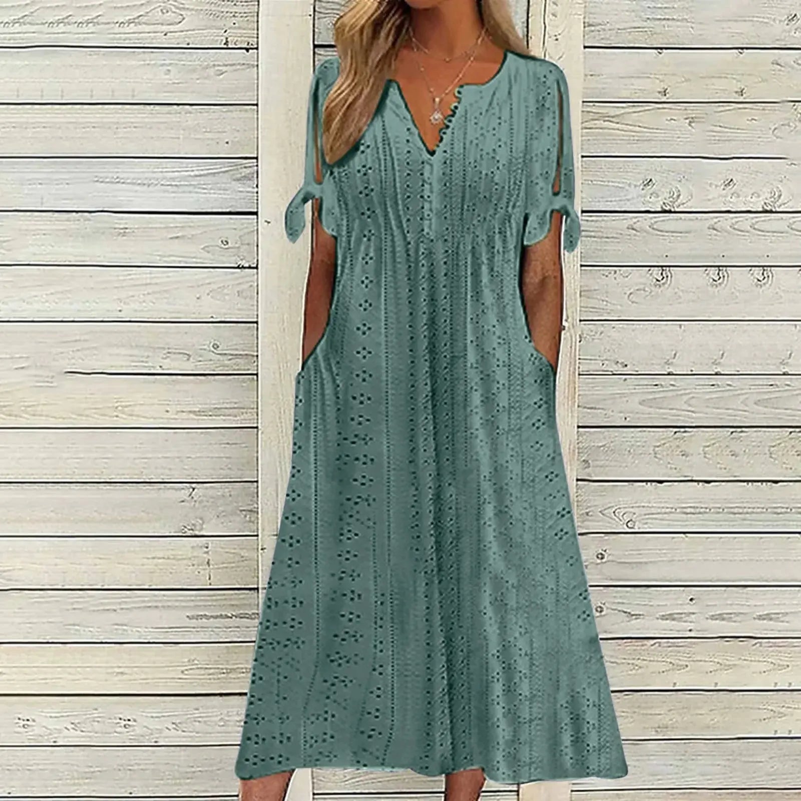 Elegant white party dress for women with hollow-out design, bow details, short sleeves, lace waist, and pockets by Lamp Post.