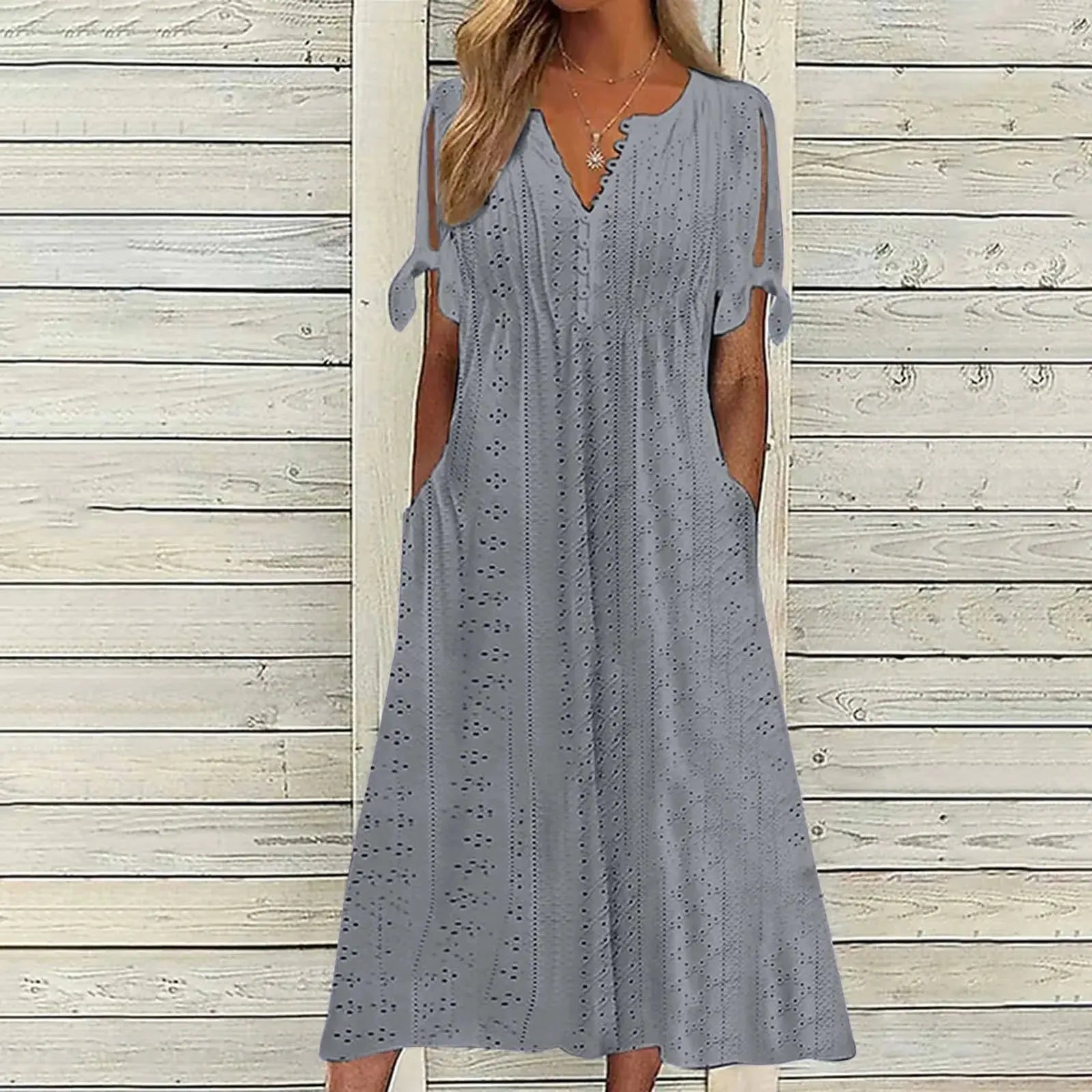 Elegant white party dress for ladies by Lamp Post with hollow-out design, bow, short sleeves, lace waist, and pockets.