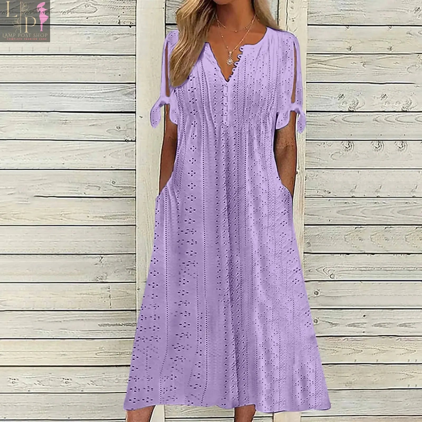 Elegant white party dress for women with hollow-out design, bow details, short sleeves, lace waist, and pockets by Lamp Post.