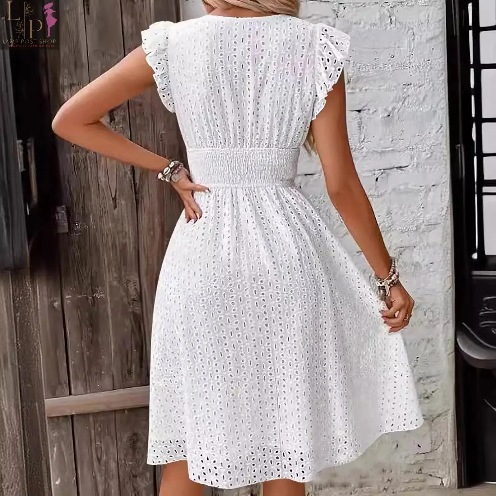 White V-neck mini dress by Lamp Post, lightweight clothing with short sleeves and a fitted silhouette.