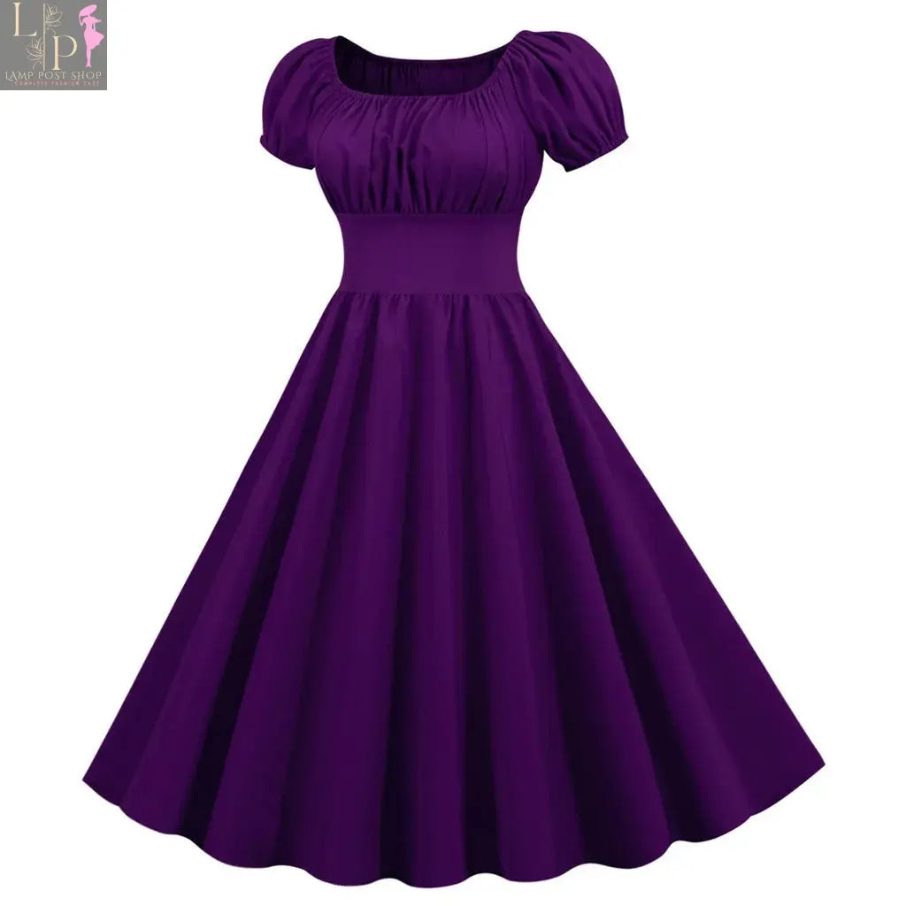 Women’s purple summer dress by Lamp Post featuring a V-neck, swing style, vintage-inspired design, perfect for parties and evenings.
