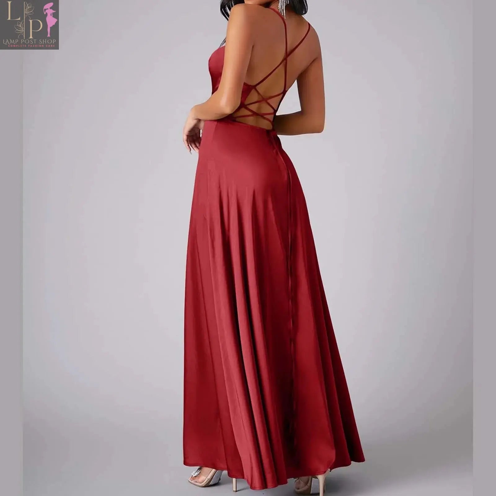 Women’s white summer dress by Lamp Post featuring a sleeveless, backless, pleated long tank top with lace-up detail.