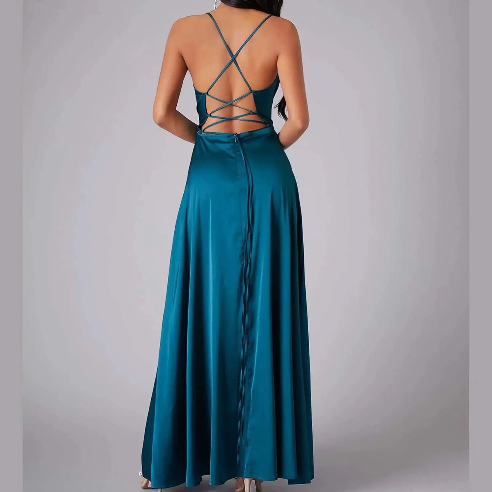 Women’s white sleeveless summer dress by Lamp Post featuring pleated design, backless style, lace-up details, and long flowing fit.