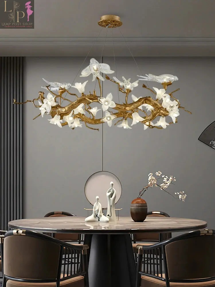 Copper LED chandelier with swallow design, artistic branch shape, ideal for restaurant, tea room, or living room lighting by Lamp Post.