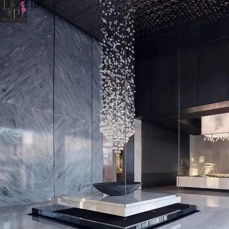 Large crystal LED chandelier by Lamp Post, featuring gradient stone design and cold white lighting for luxury staircase ceiling decor.