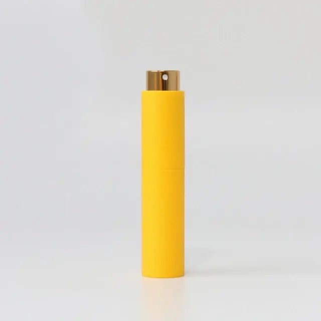 Refillable portable mini women’s perfume glass bottle by Lamp Post, compact design for easy on-the-go fragrance application