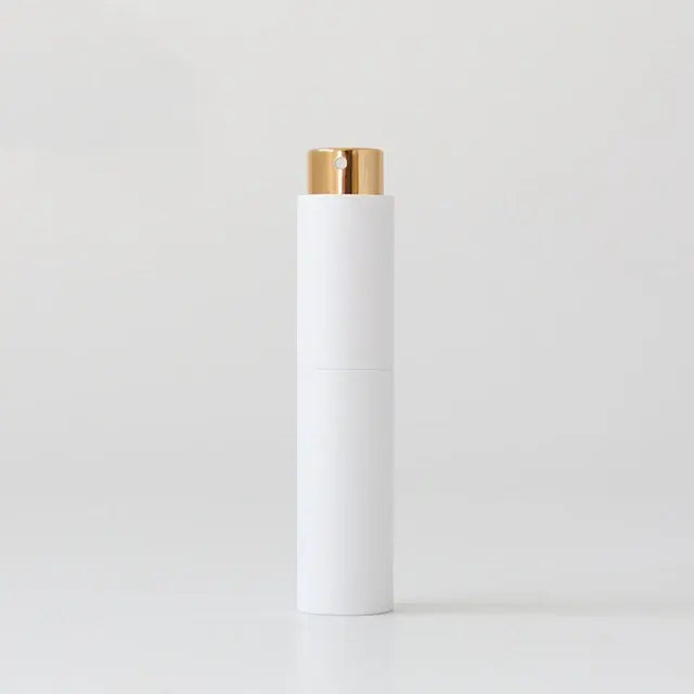 Refillable mini women's perfume glass bottle by Lamp Post, portable and compact for on-the-go fragrance application.