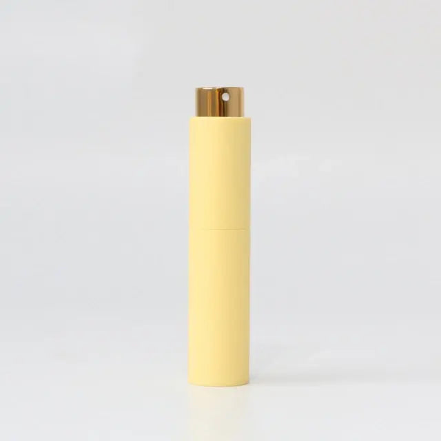 Refillable portable mini women’s perfume glass bottle by Lamp Post, compact and stylish for on-the-go fragrance application.