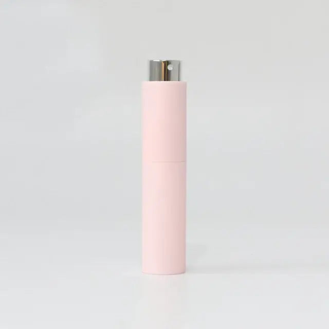 Refillable portable mini women’s perfume glass bottle from Lamp Post, compact and stylish for on-the-go fragrance.