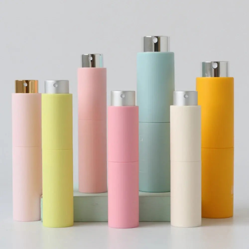 Refillable portable mini women’s perfume glass bottle by Lamp Post, compact and sleek for on-the-go fragrance application.