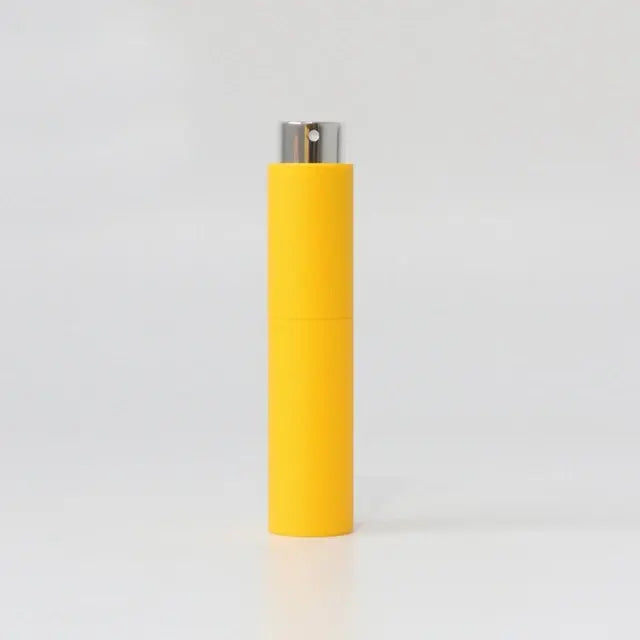 Small, refillable women's perfume glass bottle from Lamp Post, portable and stylish for on-the-go fragrance application.