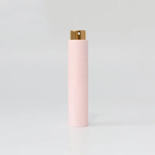 Portable mini women’s perfume glass bottle by Lamp Post, refillable and compact for easy carrying and use.