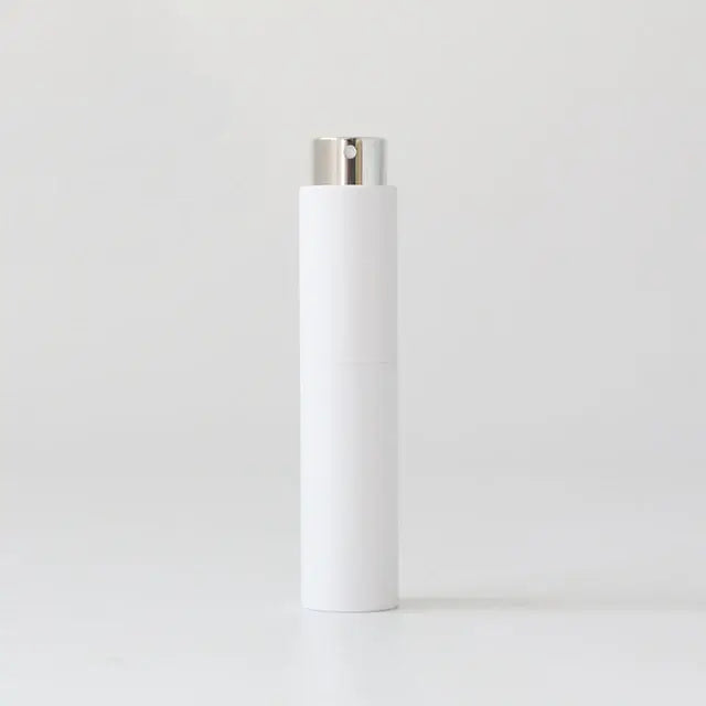 Refillable portable mini women's perfume glass bottle by Lamp Post, compact design for easy carrying and elegant fragrance application.
