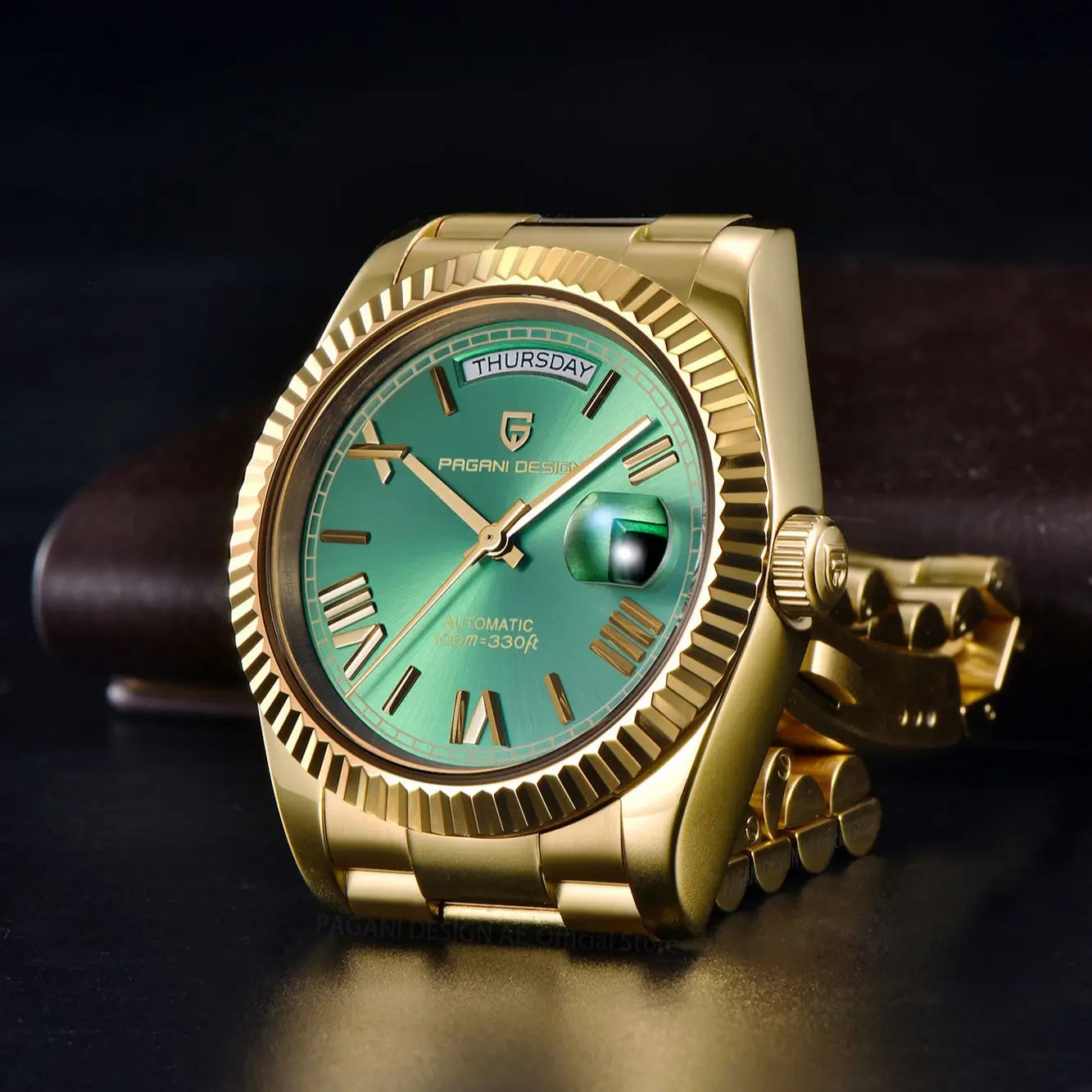 Gold and green men's luxury automatic mechanical watch by Lamp Post with sapphire glass, featuring a detailed dial and elegant design.