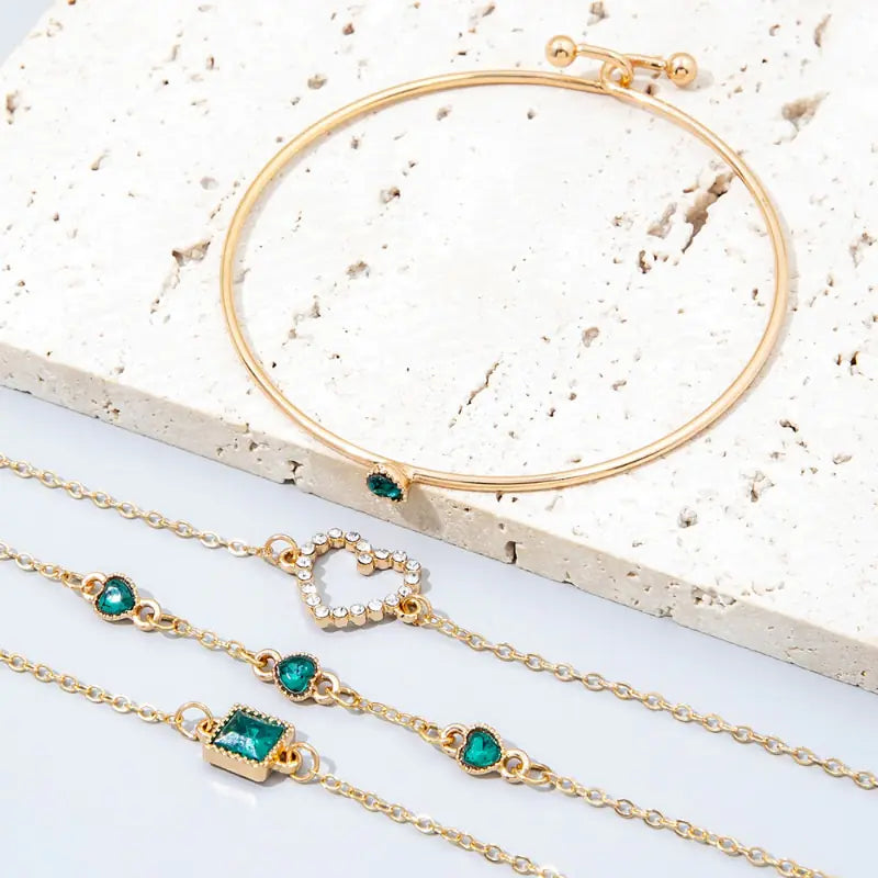 Gold inlaid bracelet jewelry set by Lamp Post featuring elegant design with intricate inlay details and matching accessories.