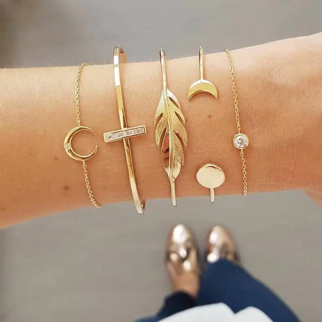 Gold inlaid bracelet jewelry set by Lamp Post featuring elegant design and intricate detailing on the bracelet.