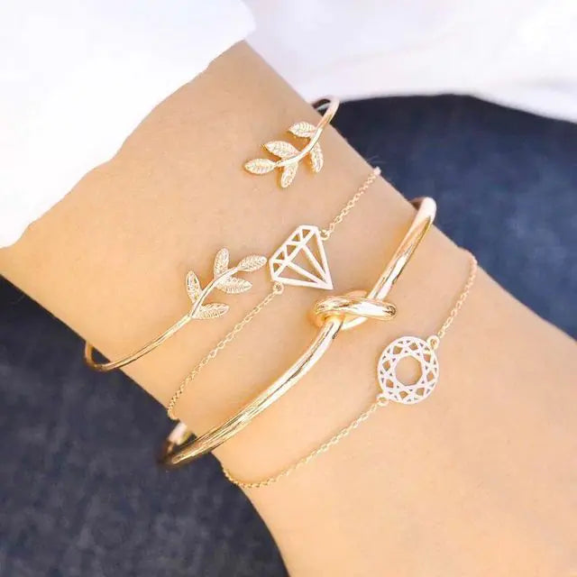 Gold inlaid bracelet jewelry set by Lamp Post featuring elegant design and intricate detailing on the bracelet.