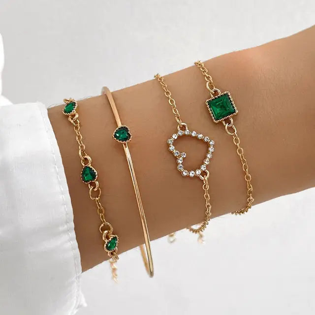 Gold inlaid bracelet jewelry set by Lamp Post featuring elegant design and intricate detailing on the bracelet and matching accessories.