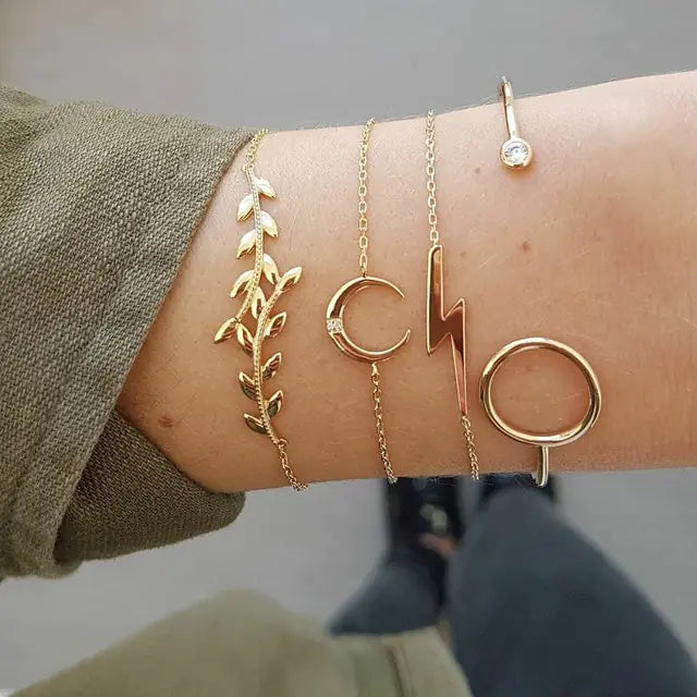 Gold inlaid bracelet jewelry set by Lamp Post featuring intricate design and elegant craftsmanship.
