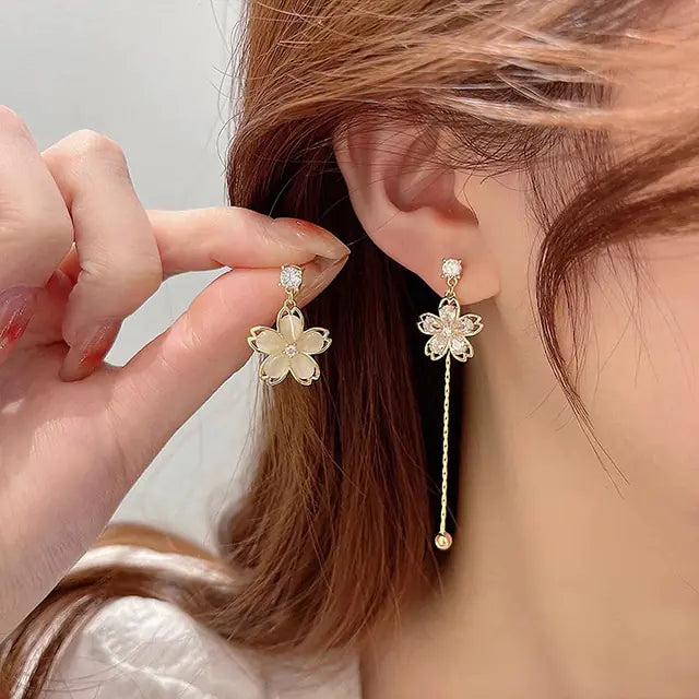 Gold flower earrings set by Lamp Post featuring delicate floral design and elegant style, perfect for accessories and jewelry.