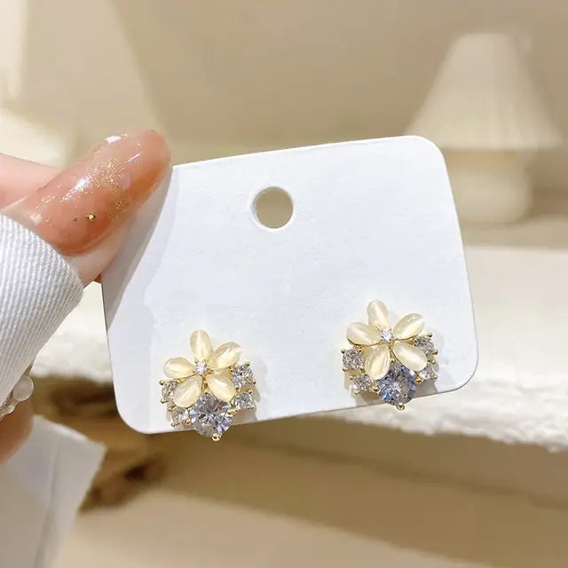 Gold flower earrings set by Lamp Post featuring delicate floral design and elegant style for fashionable accessories