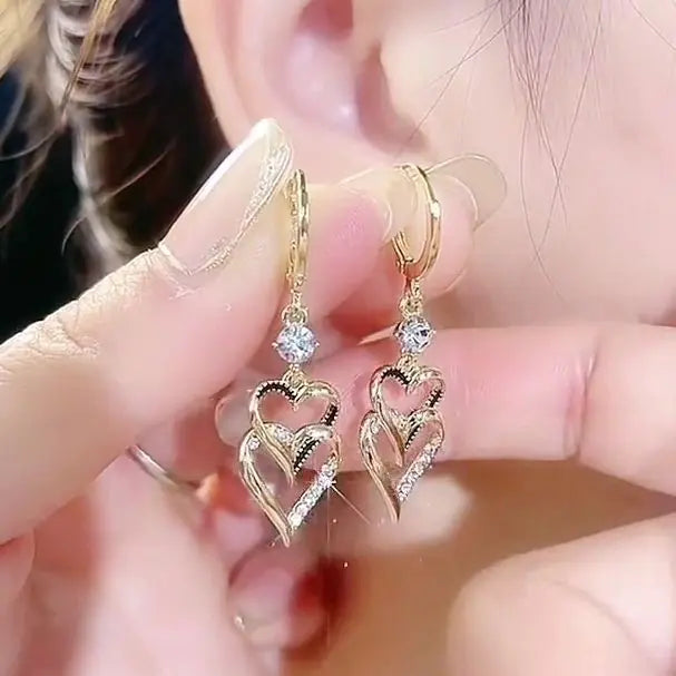 Gold flower earrings set by Lamp Post featuring delicate floral design in a stylish jewelry accessory.