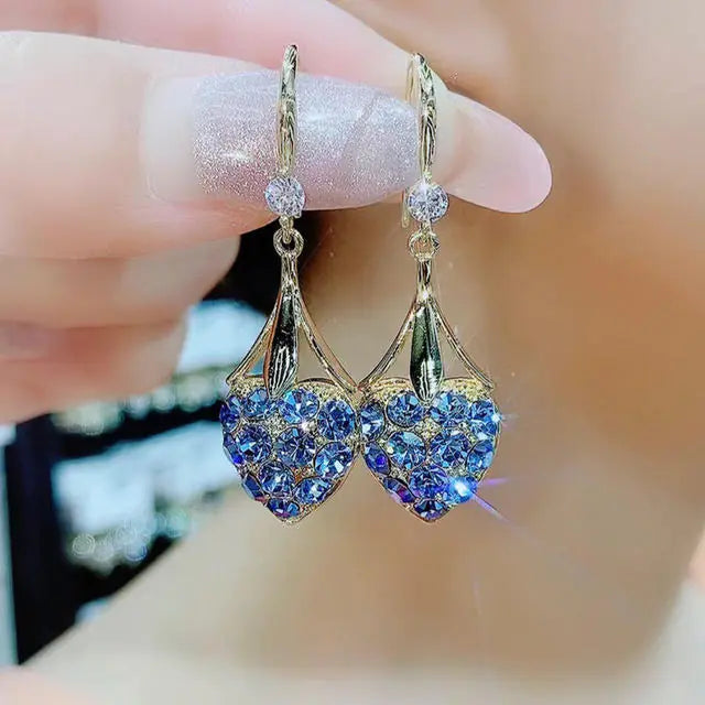 Gold flower earrings set by Lamp Post featuring delicate floral design in a stylish jewelry style.