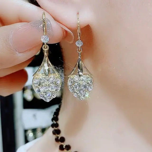 Gold flower earrings set by Lamp Post featuring delicate floral design and elegant craftsmanship.