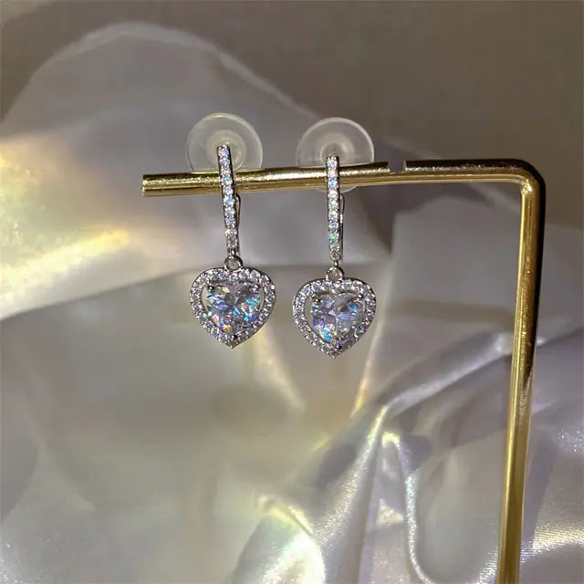 Gold flower earrings set by Lamp Post featuring delicate floral designs on elegant jewelry for women.