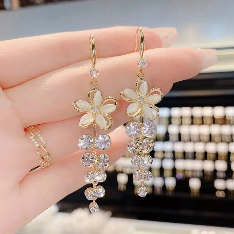 Gold flower earrings set by Lamp Post featuring delicate floral design and stylish stud style for elegant wear.