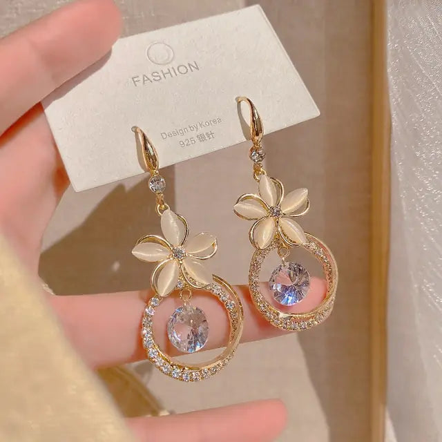 Gold flower earrings set by Lamp Post with intricate floral design, perfect for elegant or casual wear.