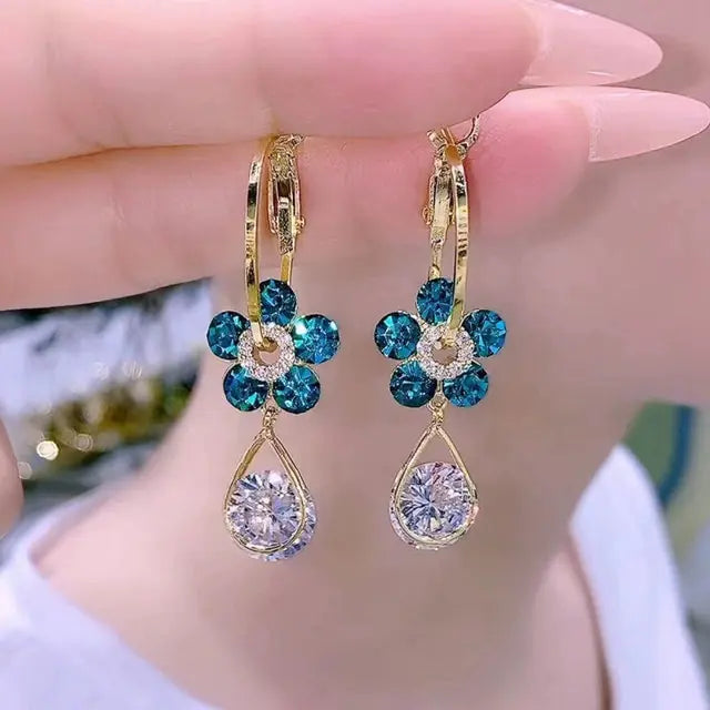 Gold flower earrings set by Lamp Post featuring delicate floral design and elegant style for versatile wear