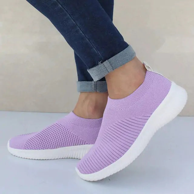 Gray women's sneakers from Lamp Post featuring stylish design and comfortable fit, shown from a side view.