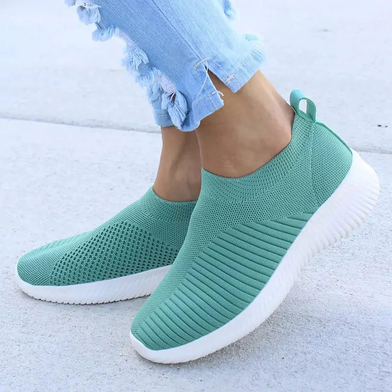 Gray Lamp Post women's sneakers with white soles and laces, casual athletic footwear for women.