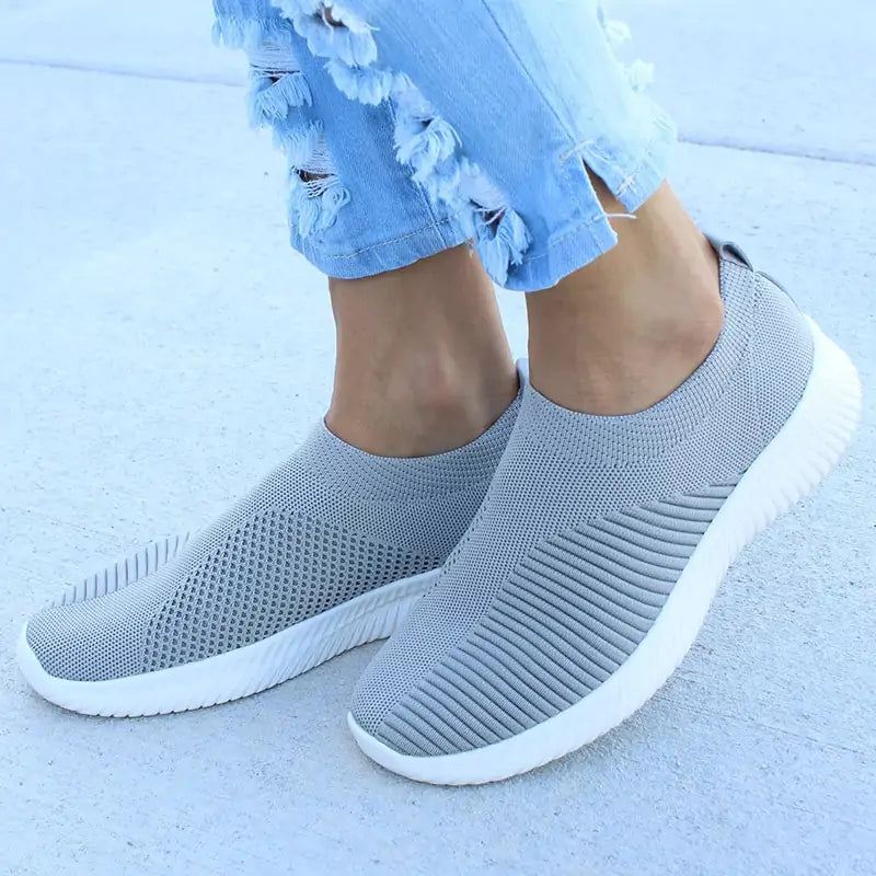 Gray women's sneakers by Lamp Post, featuring stylish design and comfortable fit, shown on a plain background.