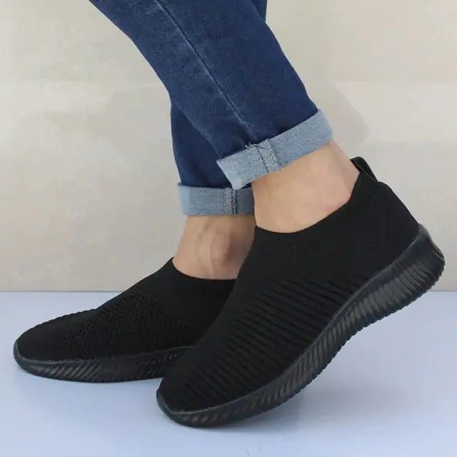 Gray women’s sneakers by Lamp Post featuring a casual design and comfortable sole, perfect for everyday wear.