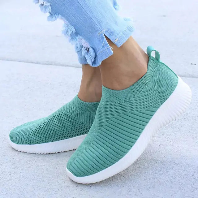 Gray women's sneakers by Lamp Post, stylish casual shoes with comfortable design and lace-up closure.