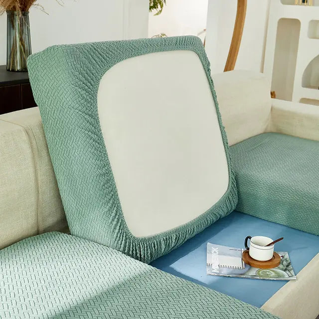 Green universal sofa cover by Lamp Post with back cushion, designed to protect and refresh your sofa's appearance.