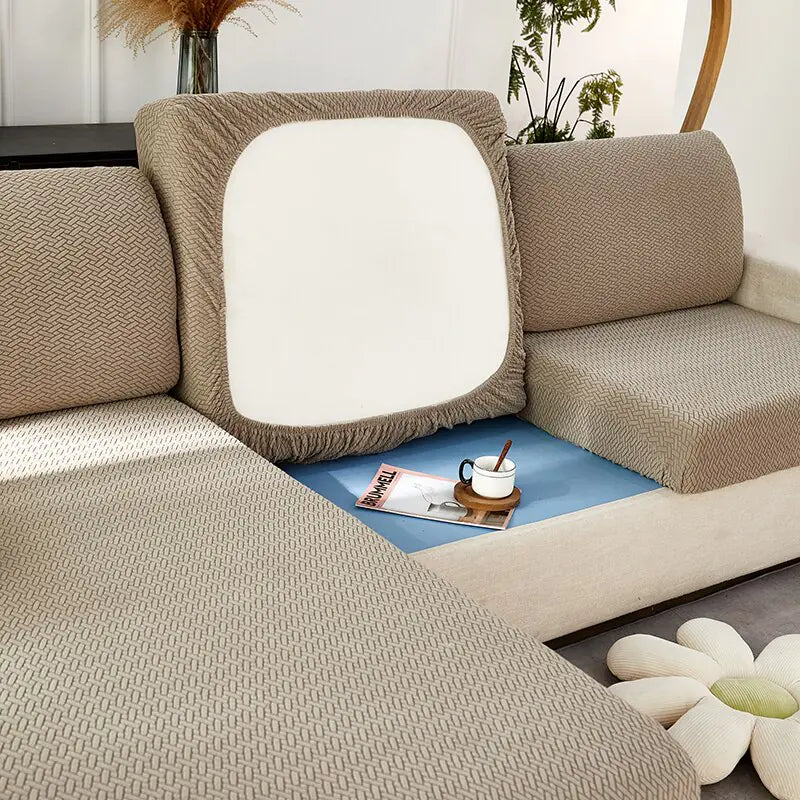 Green universal sofa cover by Lamp Post with back cushions, protects and refreshes your sofa with a soft, fitted fabric.