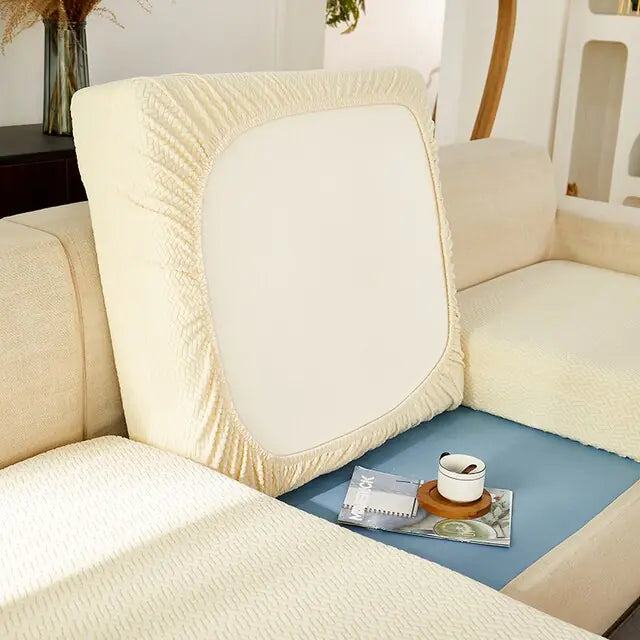 Green universal sofa cover by Lamp Post with back cushions, protecting and updating the look of your sofa.