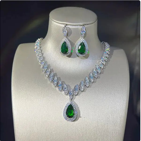 Green women necklace and earring set by Lamp Post featuring matching jewelry with elegant design and intricate details.