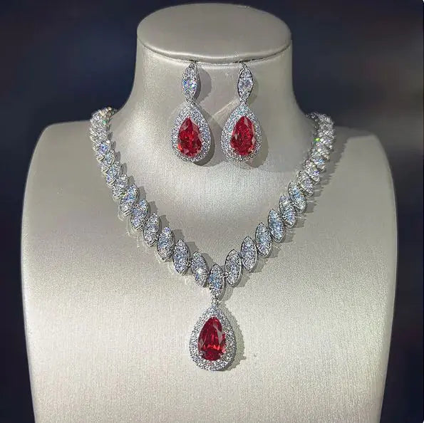 Green women necklace and earring set by Lamp Post featuring matching jewelry with elegant design and silver accents.